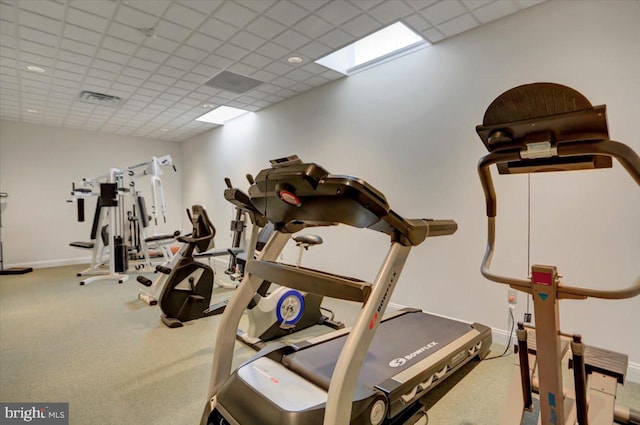 exercise area with carpet and a paneled ceiling