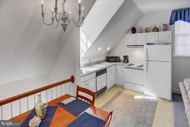 kitchen with white appliances, a notable chandelier, white cabinets, hanging light fixtures, and lofted ceiling