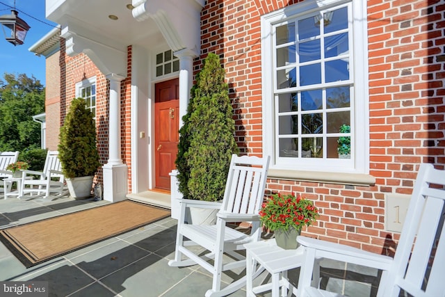 entrance to property featuring a porch