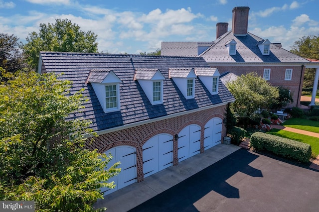 373 Craig Rd, Greencastle, PA 17225 - view of front of property featuring a garage, a chimney, aphalt driveway, and brick siding