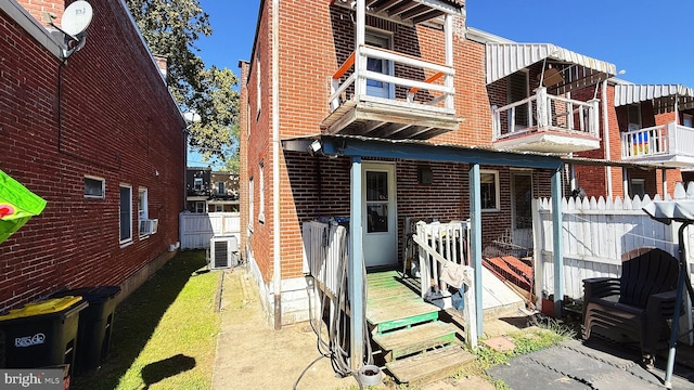 back of property featuring central air condition unit