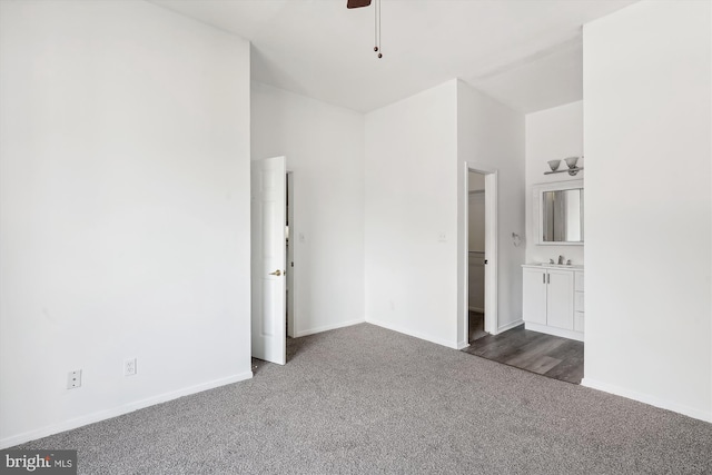 carpeted empty room featuring sink