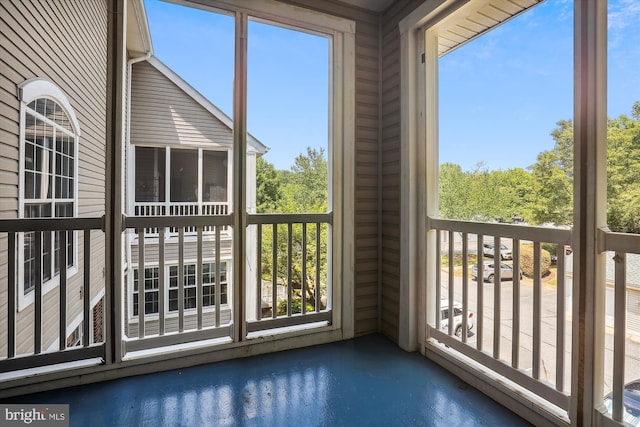 unfurnished sunroom featuring a wealth of natural light