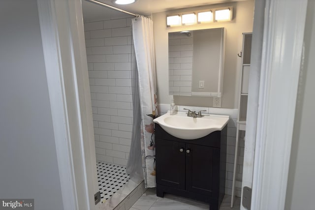 bathroom with vanity and walk in shower