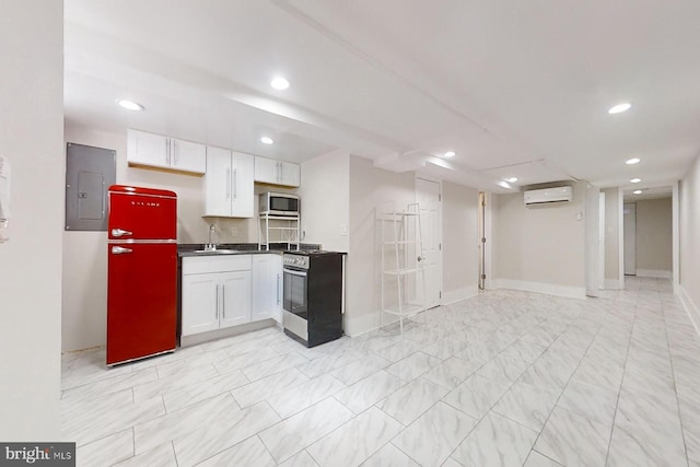 kitchen featuring a wall mounted air conditioner, electric panel, white cabinets, sink, and stainless steel appliances