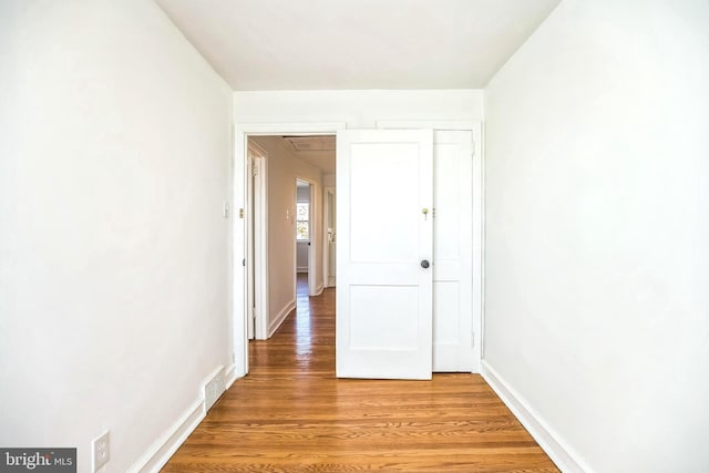 hallway featuring hardwood / wood-style floors