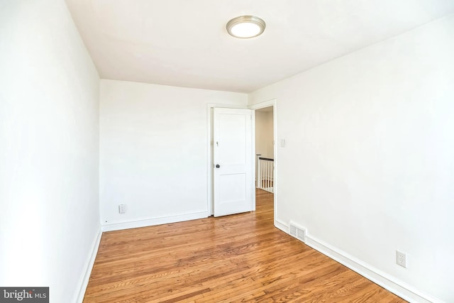 spare room featuring light hardwood / wood-style flooring