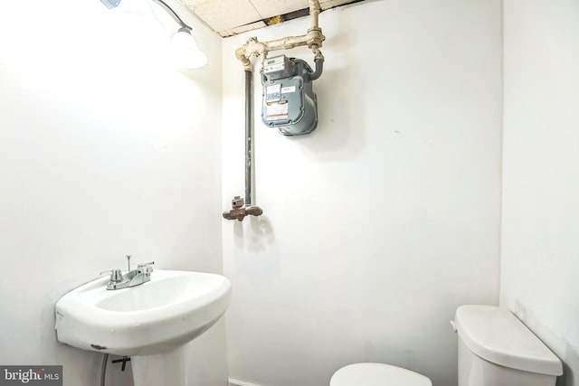 bathroom with sink and toilet