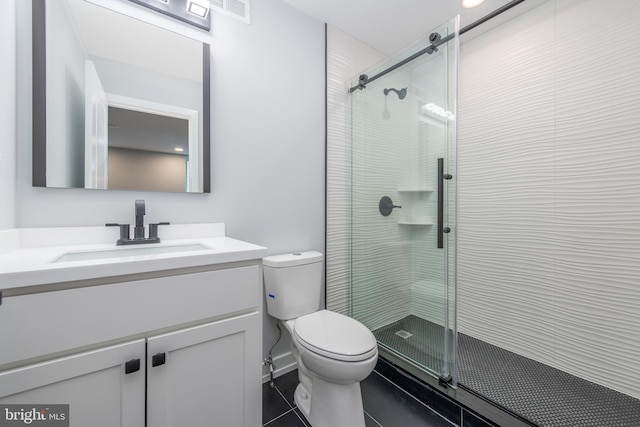 bathroom featuring vanity, toilet, tile patterned flooring, and a shower with door