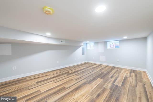 basement featuring hardwood / wood-style floors