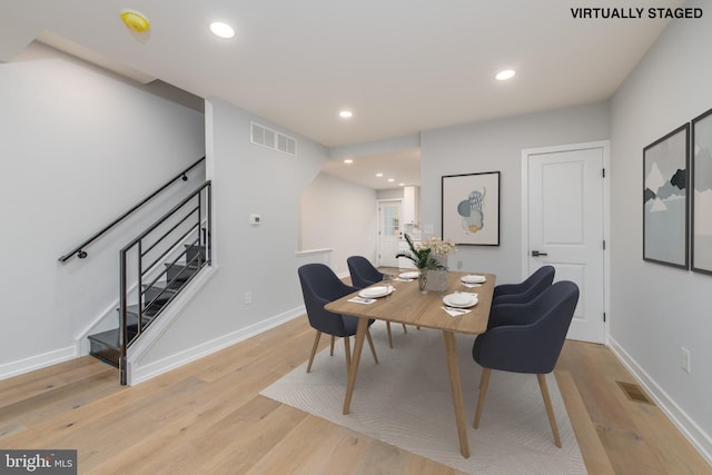 dining area with light hardwood / wood-style floors