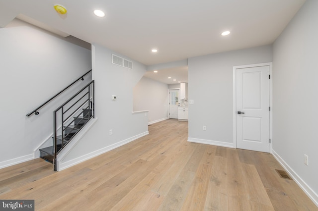 unfurnished living room featuring light wood-type flooring