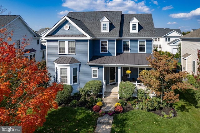 view of front of house featuring a front yard and a porch