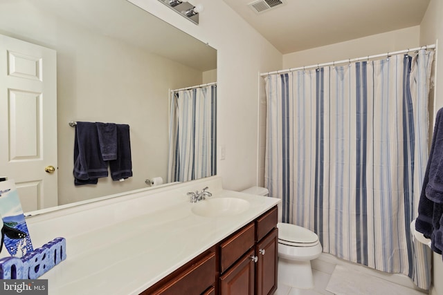 bathroom with walk in shower, vanity, toilet, and tile patterned flooring