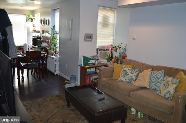 living room with dark wood-type flooring and cooling unit