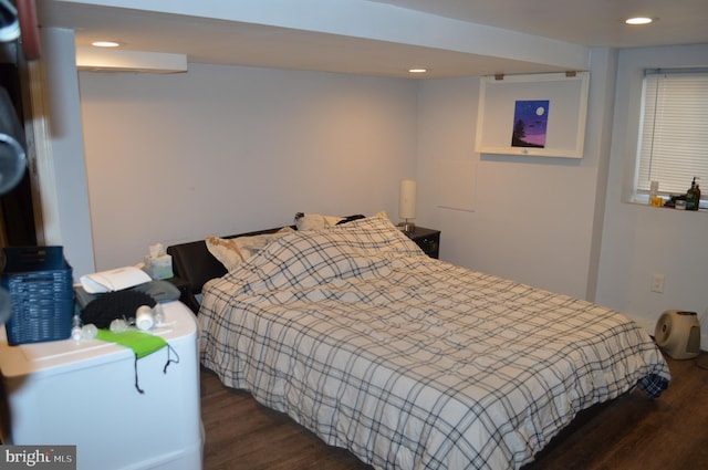 bedroom featuring dark wood-type flooring