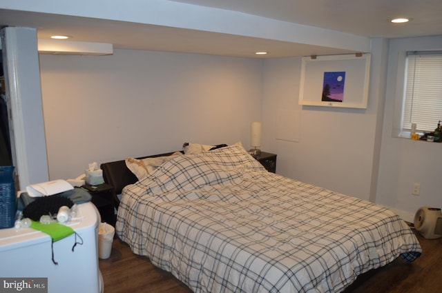 bedroom featuring dark hardwood / wood-style flooring