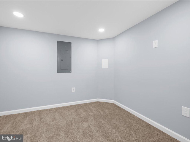 carpeted empty room featuring electric panel