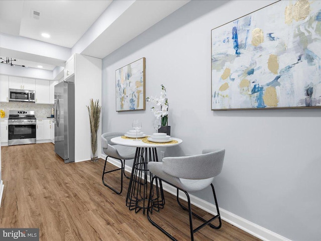 dining space featuring light hardwood / wood-style floors