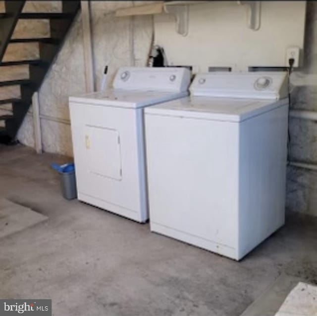 clothes washing area with washer and dryer