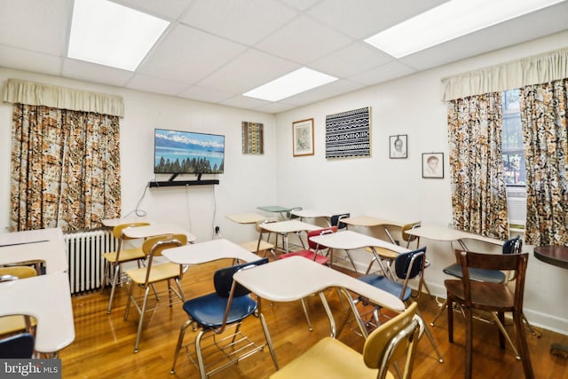 3536 Minnesota Ave SE, Washington, DC 20019 - dining room featuring radiator, wood finished floors, and a paneled ceiling