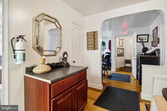 3536 Minnesota Ave SE, Washington, DC 20019 - corridor featuring arched walkways and light wood-type flooring
