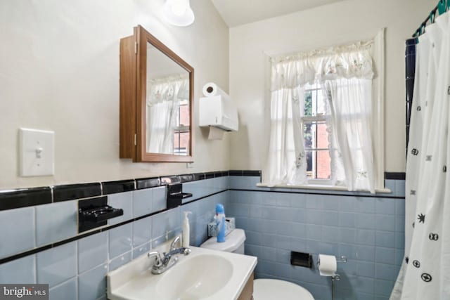 3536 Minnesota Ave SE, Washington, DC 20019 - full bath featuring tile walls, a wainscoted wall, and a shower with shower curtain