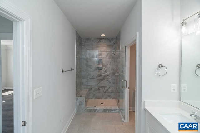 bathroom with vanity, hardwood / wood-style floors, and a shower with door