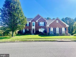 view of front of home featuring a front yard