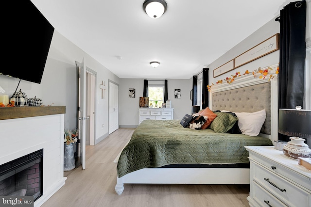 bedroom with light wood-type flooring