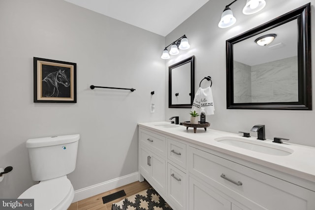 bathroom featuring hardwood / wood-style floors, vanity, and toilet