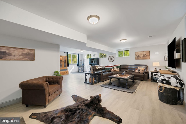 living room with light hardwood / wood-style flooring