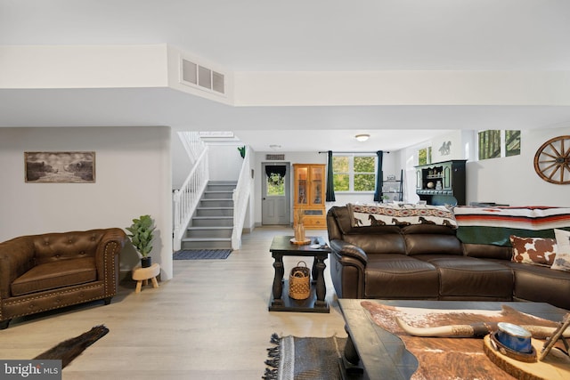 living room with light hardwood / wood-style floors