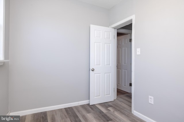 empty room with light hardwood / wood-style floors