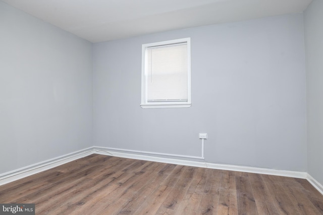 spare room featuring hardwood / wood-style flooring