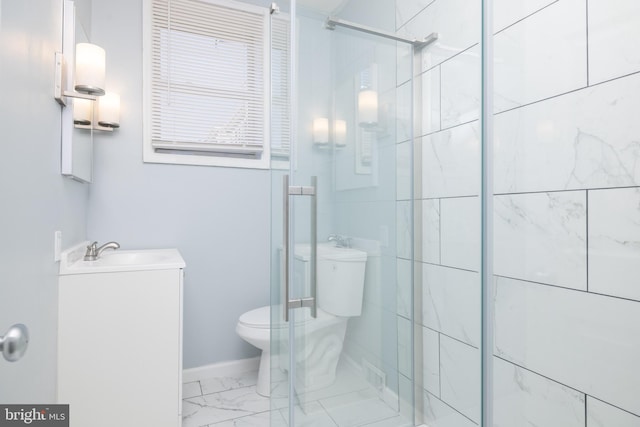 bathroom featuring walk in shower, vanity, and toilet