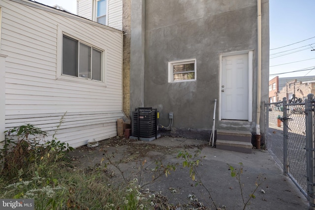 view of exterior entry featuring central AC