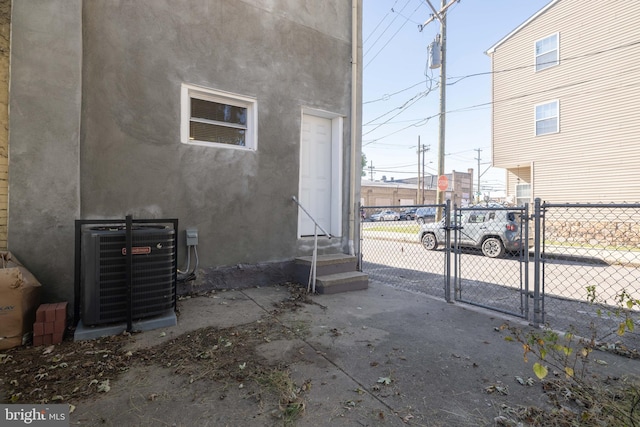 view of side of home with cooling unit