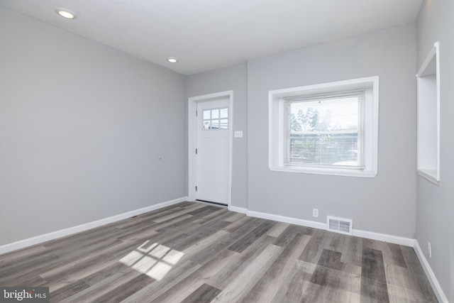 foyer entrance with hardwood / wood-style flooring