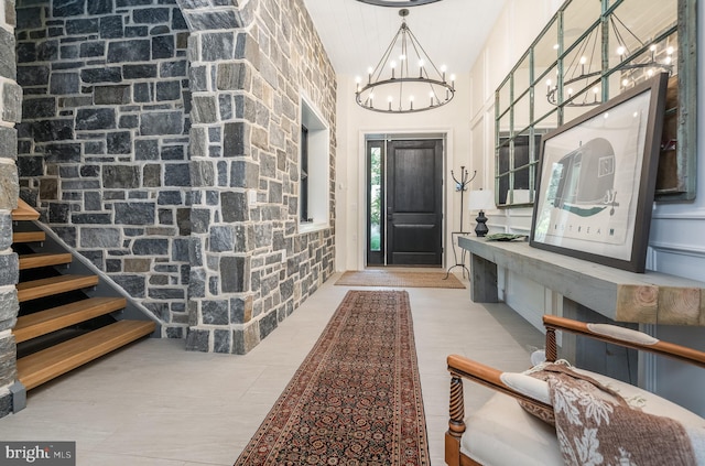 entrance foyer with high vaulted ceiling