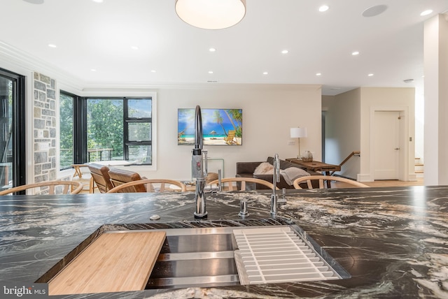 kitchen featuring ornamental molding and sink