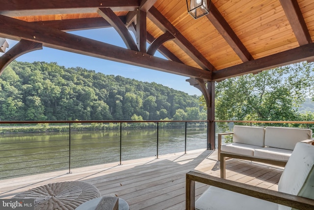 wooden terrace featuring a water view