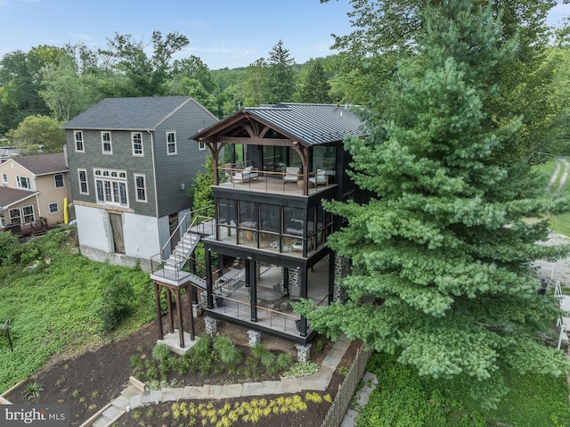 back of property with a gazebo