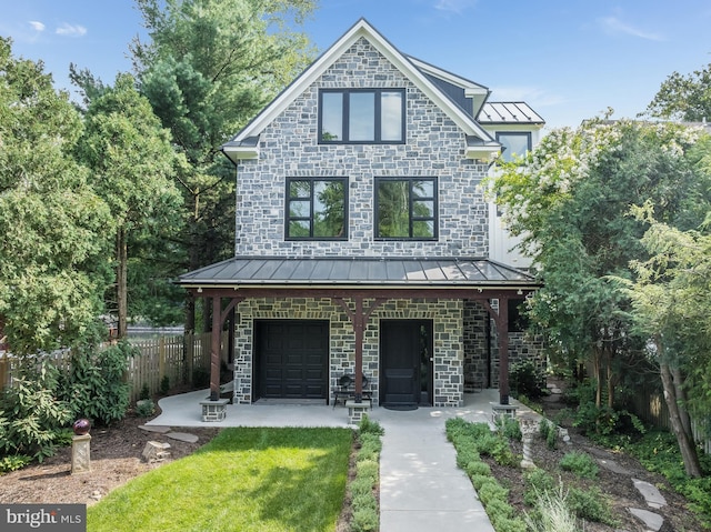 view of front of house with a front lawn and a garage