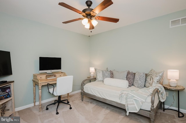 bedroom featuring light carpet and ceiling fan