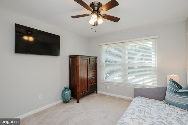 carpeted bedroom featuring ceiling fan