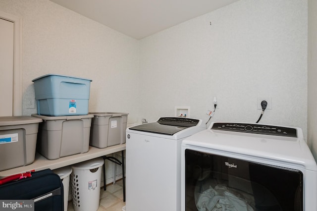 washroom featuring washer and clothes dryer