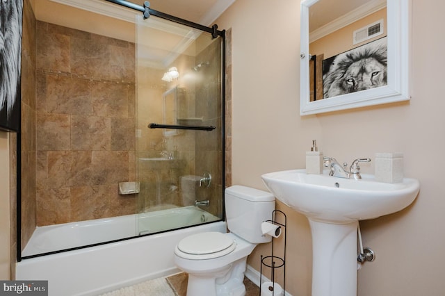 full bathroom with ornamental molding, sink, toilet, and enclosed tub / shower combo