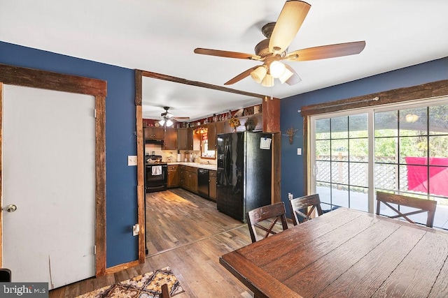 dining room with wood-type flooring and ceiling fan