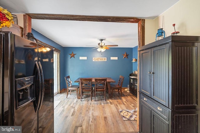 dining area with ceiling fan and light wood-type flooring